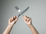knife-fork-with-hand-grey-background-utensil-kitchen-cooking